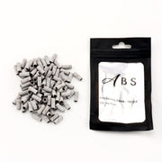 A pile of gray mini serving bands with black ends next to a black resealable pouch labeled 'ABS Mini Serving Bands - 180 Cut 100 Per Pack' on a white background.