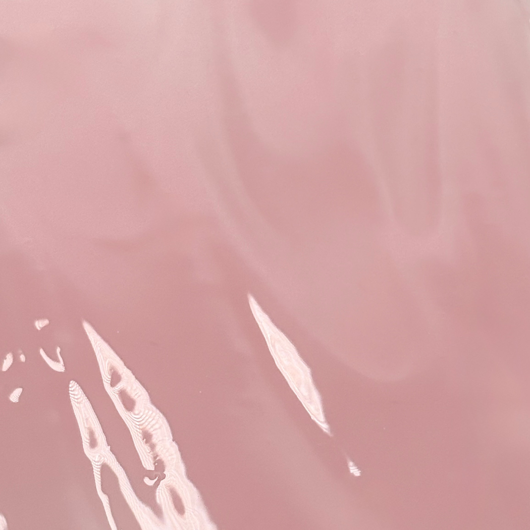 White abstract shapes on a pink background